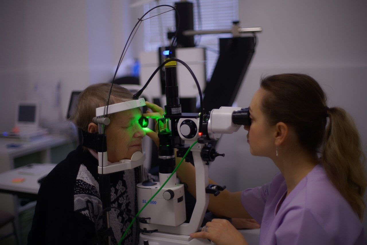 Male senior having cataract examination