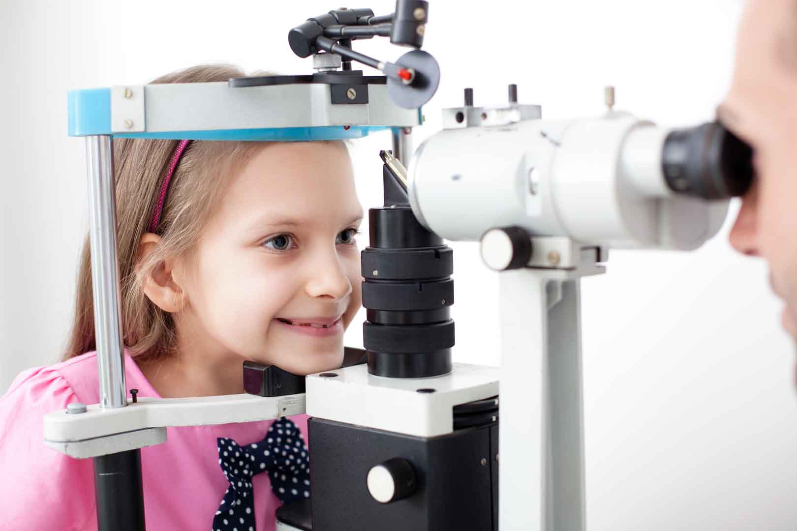 Young girl getting an eye exam at Newport Beach.