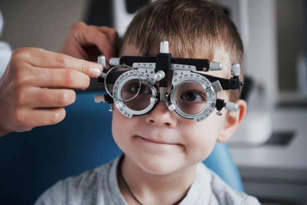 Boy getting his eye examined