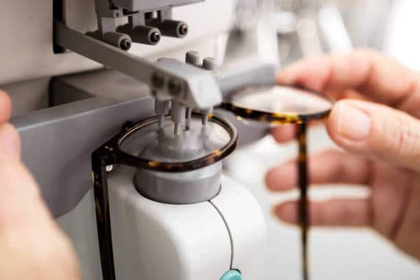 Optometrist measuring glass on eyewear