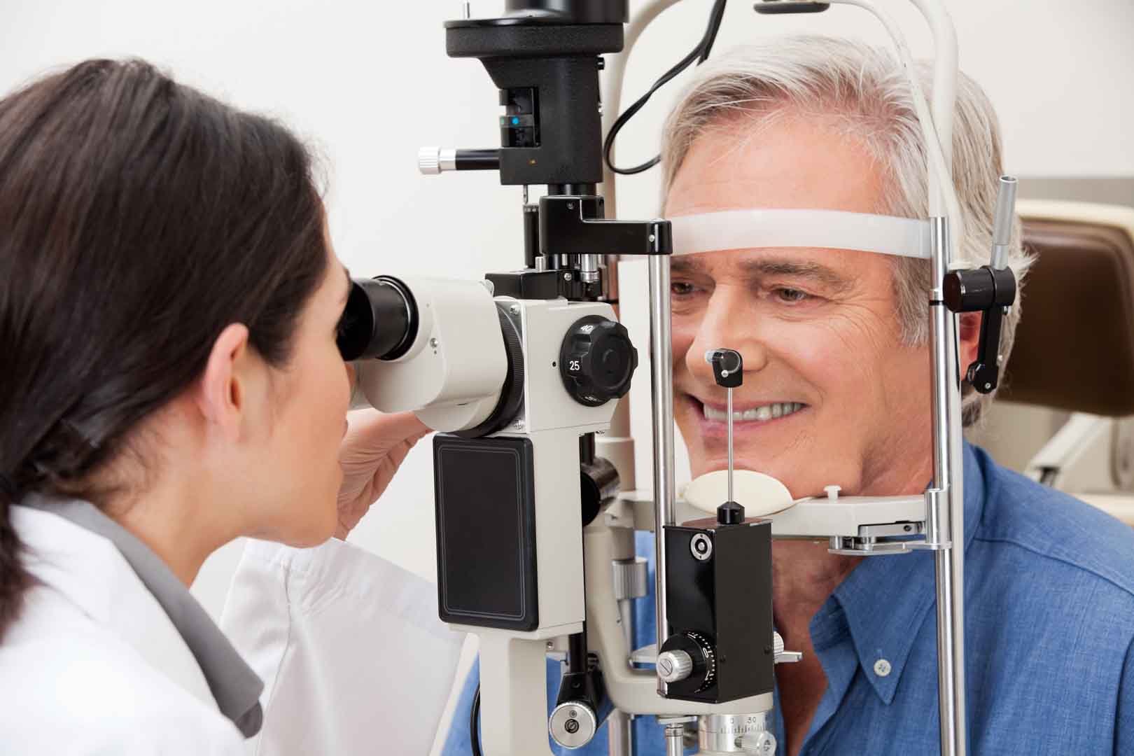 Elderly male getting an eye exam at Newport Beach.