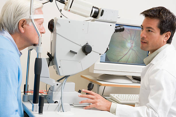 Doctor examining senior suffering from diabetic retinopathy